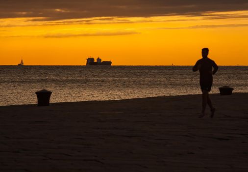 Man jogging next to the Trieste sea