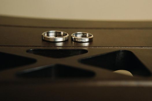 Close-up of two gold wedding rings for a wedding.