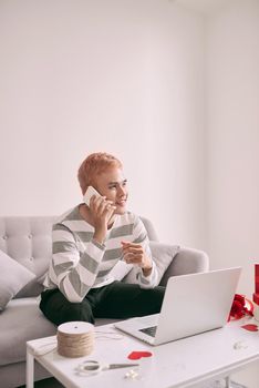 Handsome guy holding red rose, call from girlfriend.