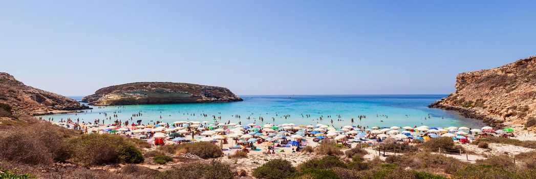 LAMPEDUSA, ITALY - AUGUST, 03: View of the most famous sea place of Lampedusa, It is named Spiaggia dei conigli, in English language Rabbits Beach or Conigli island on August 03, 2018