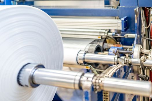 production of plastic packaging in a factory on an automated line.