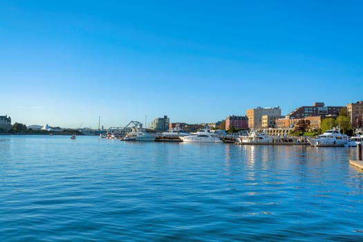 Victoria downtown waterfront view at sunset time with yachts moorred at the pier