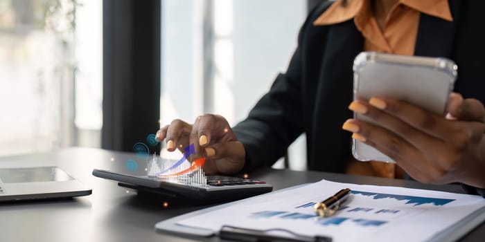 Accountant black woman working on laptop and do document, tax, exchange, accounting and Financial advisor concept.