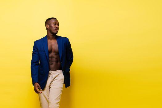 African American millennial businessman isolated on a studio background, successful male formal suit