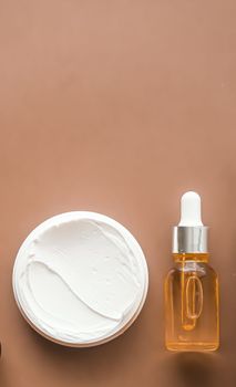 Beauty cosmetics and skincare product on beige background, flatlay.