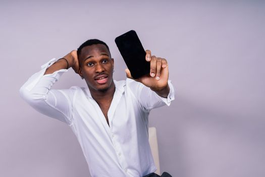 African American millennial businessman isolated on a studio background, successful male formal suit