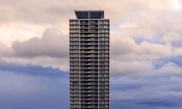 Dramatic weather and tall building after sundown. High quality photo