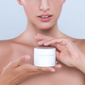 Alluring beautiful perfect cosmetic skin woman portrait hold mockup jar cream or moisturizer for skincare treatment, anti-aging product in isolated background. Natural healthy skin model concept.