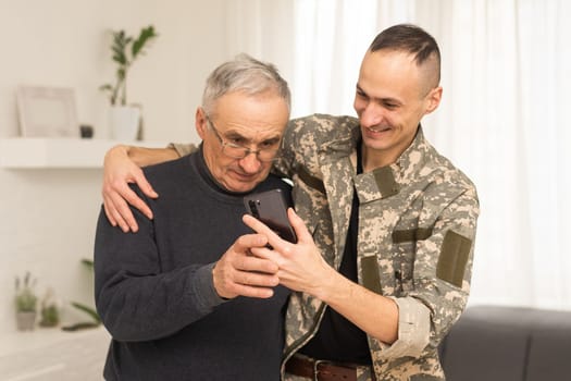 Portrait of army man with parents, elderly father and military son