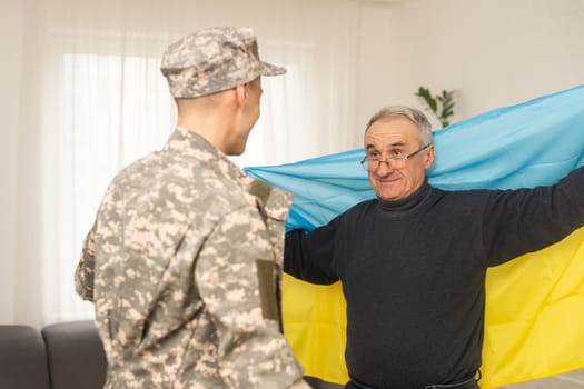 elderly father and son military flag of Ukraine.