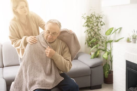 Two people holding hand together. elderly man and support woman.