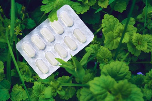 a small round mass of solid medicine to be swallowed whole.