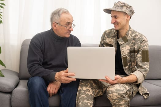 Portrait of army man with parents, elderly father and military son