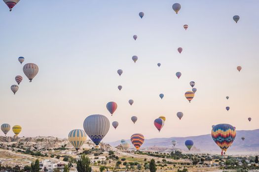 Colorful hot air balloon flying over Cappadocia, Turkey.