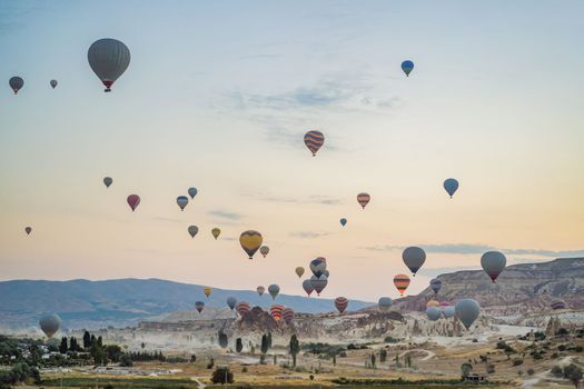 Colorful hot air balloon flying over Cappadocia, Turkey.