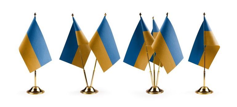 Small national flags of the Ukraine on a white background.