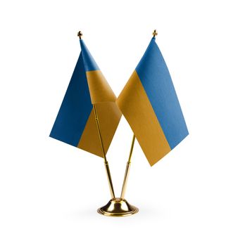 Small national flags of the Ukraine on a white background.