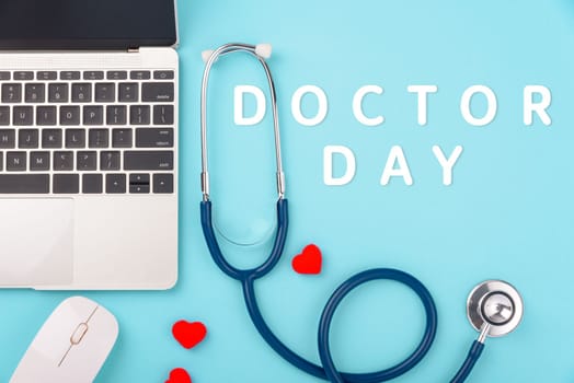 Doctor's Day concept, flat lay doctor stethoscope with laptop computer and diagnosis heart disease isolated on blue background with copy space for text, Medical and Health care insurance