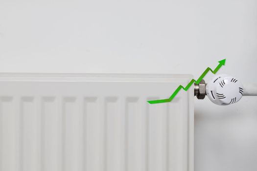 Saving money, green arrow going up, copy space Heating bill. Increase in the cost of gas bill. Soaring energy prices. Increase in the price of natural gas. Energy crisis in Europe. Hands hold wallet with money near the radiator. Pay the bills. white