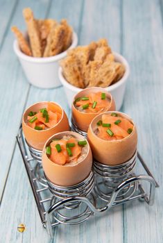 Recipe eggs casserole cooked in the shell with mushroom cream sauce and smoked salmon, High quality photo