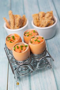 Recipe eggs casserole cooked in the shell with mushroom cream sauce and smoked salmon, High quality photo