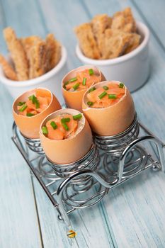 Recipe eggs casserole cooked in the shell with mushroom cream sauce and smoked salmon, High quality photo