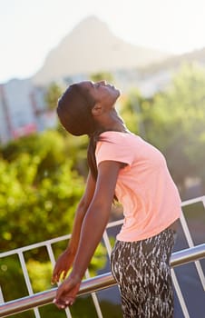 Enjoying a carefree workout. an attractive young woman exercising outdoors