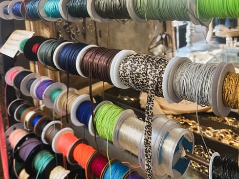 Reels of ribbons hanging in a store