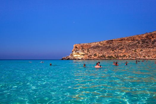 LAMPEDUSA, ITALY - AUGUST, 03: View of the most famous sea place of Lampedusa, It is named Spiaggia dei conigli, in English language Rabbits Beach or Conigli island on August 03, 2018