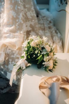 wedding bouquet with roses on the table.The decor at the wedding.