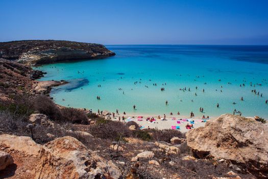 LAMPEDUSA, ITALY - AUGUST, 03: View of the most famous sea place of Lampedusa, It is named Spiaggia dei conigli, in English language Rabbits Beach or Conigli island on August 03, 2018