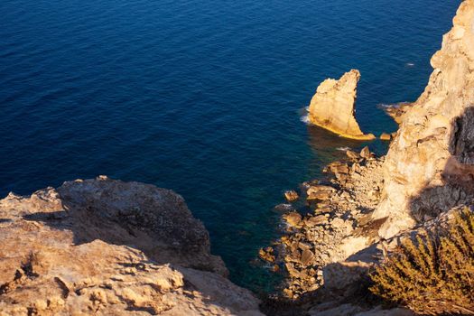 View of the famous cliff called La vela in Lampedusa, Sicily