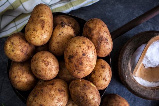 Close up of new potatoes on dark background