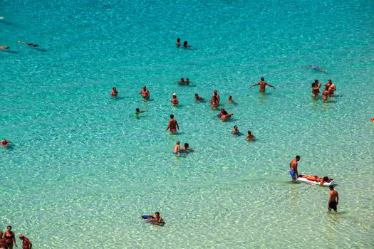 LAMPEDUSA, ITALY - AUGUST, 03: View of the most famous sea place of Lampedusa, It is named Spiaggia dei conigli, in English language Rabbits Beach or Conigli island on August 03, 2018