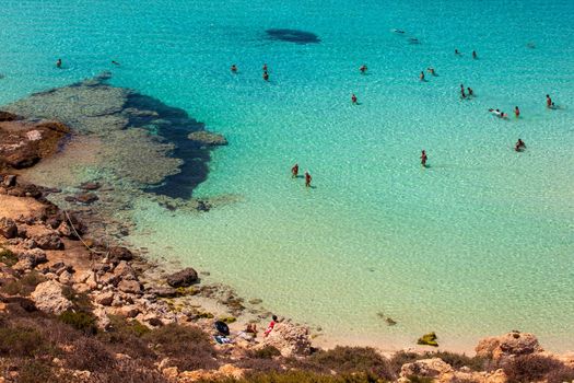 LAMPEDUSA, ITALY - AUGUST, 03: View of the most famous sea place of Lampedusa, It is named Spiaggia dei conigli, in English language Rabbits Beach or Conigli island on August 03, 2018