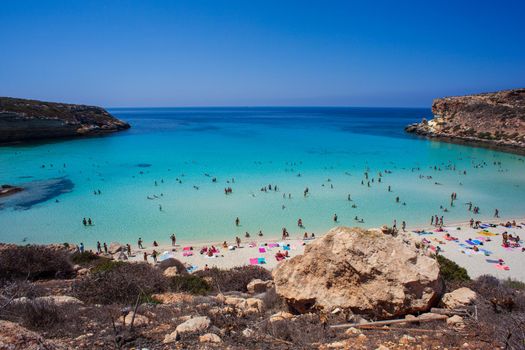 LAMPEDUSA, ITALY - AUGUST, 03: View of the most famous sea place of Lampedusa, It is named Spiaggia dei conigli, in English language Rabbits Beach or Conigli island on August 03, 2018