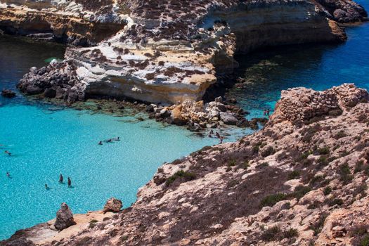 LAMPEDUSA, ITALY - AUGUST, 03: View of the most famous sea place of Lampedusa, It is named Spiaggia dei conigli, in English language Rabbits Beach or Conigli island on August 03, 2018