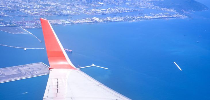 Bussiness and travel concept. Aerial view through window inside aircraft cabin with beautiful blue sky and cloud with sunlight, copy space, top view