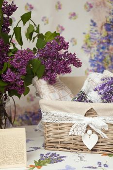 View of wicker basket and flowers on the table