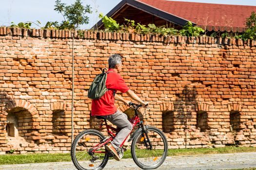 Riding the bicycle on sunny day in Alba Iulia, Romania, 2021