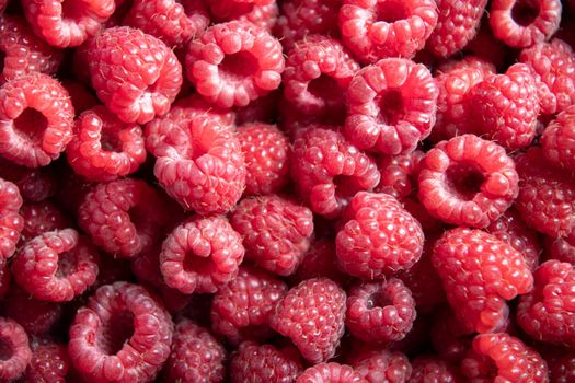 natural fruit background of fresh raspberries top view, texture of berries. High quality photo