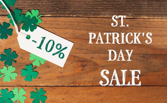 St. Patrick's Day Sale -10 percent discount on wooden background. High quality photo