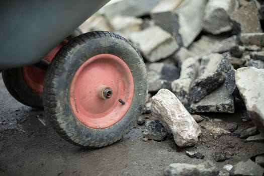 Cart for transporting sand and stones. Worker's tool. Details of construction works.