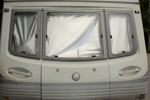 Window in motor home. Trailer parts. Transport for families and travel. White House on Wheels.