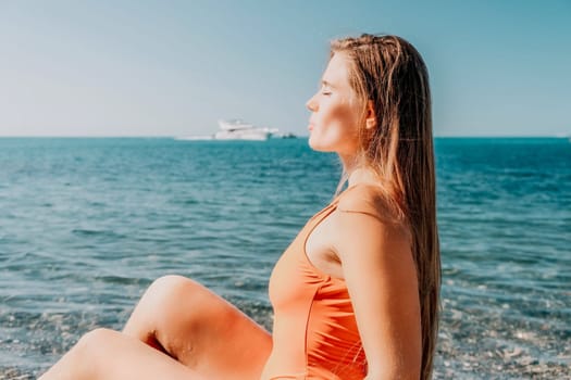 Sexy young woman in stylish bikini lying on seashore, closeup. Holiday, vacation and recreational concept.