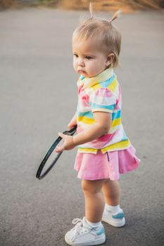charming little tennis player with a racket.