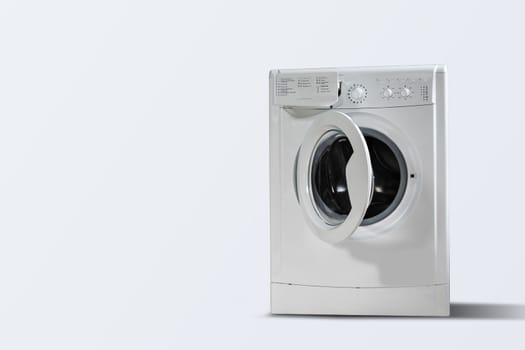 Modern washing machine white wall indoors, space for text