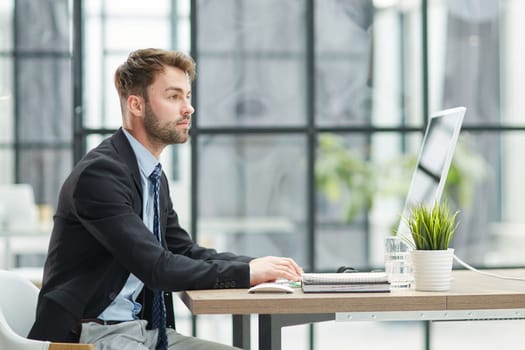 Young businessman working at office