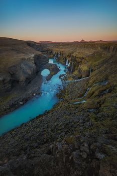Icelands mountainous landscape combined with northern latitude, which has lots of rain, snow, and glaciers, is why the country has so many waterfalls and cascading water slopes.