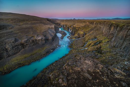 Icelands mountainous landscape combined with northern latitude, which has lots of rain, snow, and glaciers, is why the country has so many waterfalls and cascading water slopes.